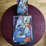 تصویر چیده شده پازل ۱۰۰۰ تکه زنی با کتاب اثر پابلو پیکاسو